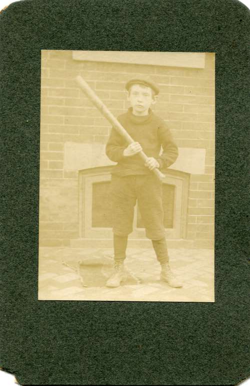 Early Boy Holding Bat